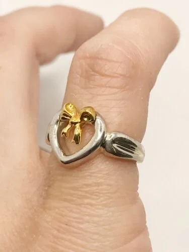 Tiffany & Co. ハート リング 1991年製 Tiffany & Co. 18KYG & SS 1991 Heart Bow Ring Size 3.5 — DeWitt's